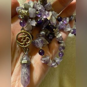 Necklace of amethyst chips, beads & point pendant with Ohm charm